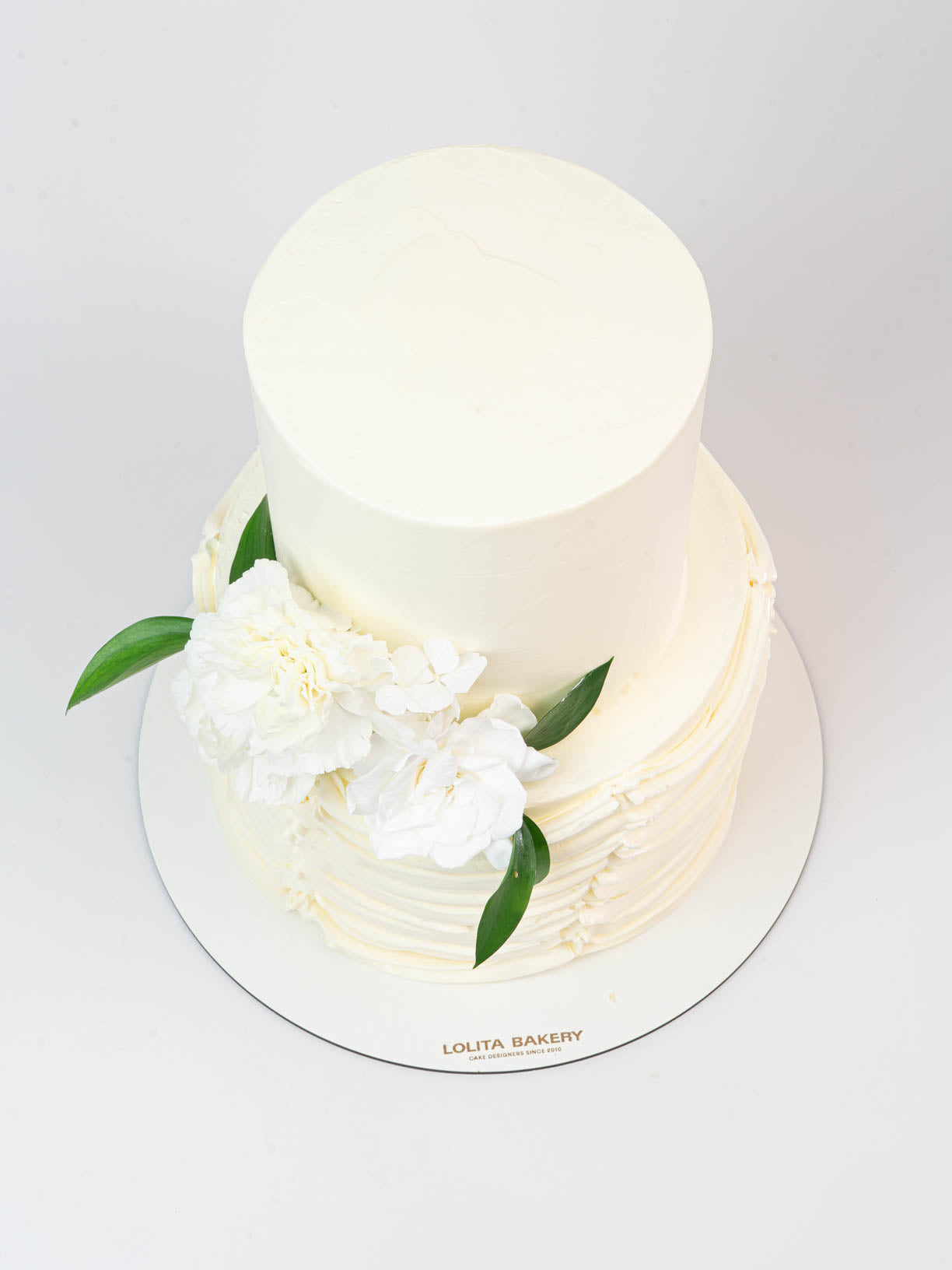Wedding Cake with Ruffles and Fresh Flowers