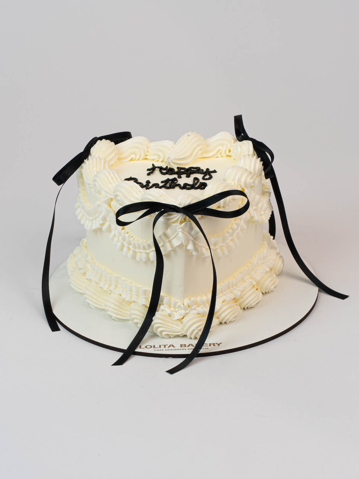 Pastel Corazón Vintage blanco con lazos negros - Lolita Bakery