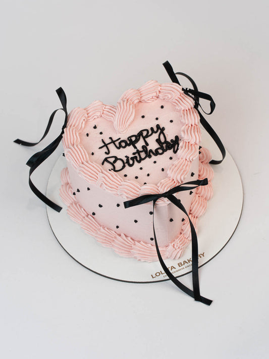 Pastel corazon rosa con topos y lazos negros - Lolita Bakery